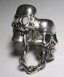 Wholesale CHAINED TOGETHER SKULL HEADS BIKER RING (Sold by the piece)