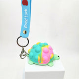 green tie dye color tortoise shape pop it fidget ball keychain toy with blue strap