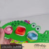 video demonstration of Green Crocodile Flipping Pop it Fidget Toys